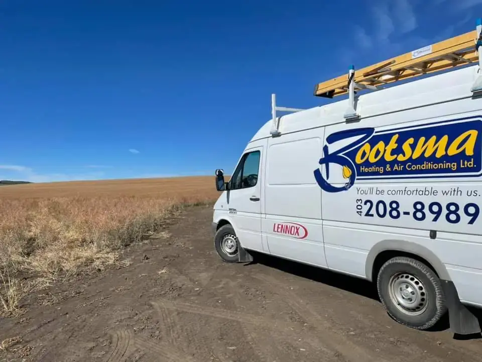 Tim and Ben Bootsma's HVAC service truck parked at Calgary home during heating system repair and maintenance visit